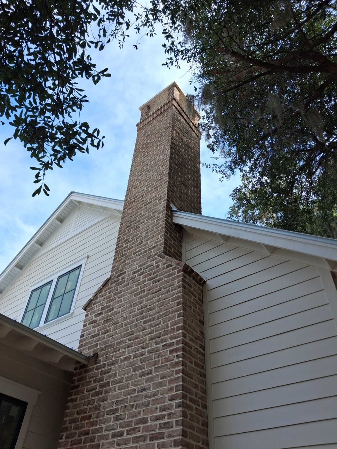Completed brick chimney on residential construction